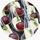 Gentle brie with pink grapes and mint on spoons