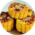 Corn baked with butter on skewers