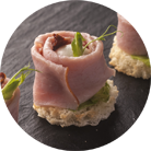 Canapes with boiled pork, baby mozzarella and sun-dried tomatoes